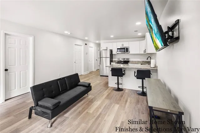 a living room with furniture and a rug