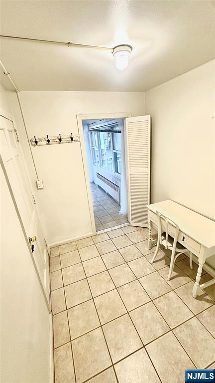 90 Clark Street Garfield, NJ 07026 - Photo 17 of 17 a bedroom with a bed and cabinets
