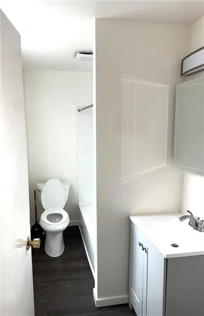 a bathroom with a toilet and a sink