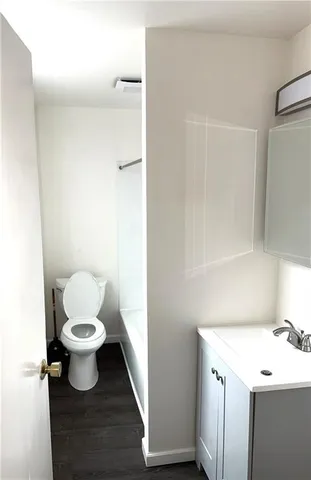 a bathroom with a toilet and a sink