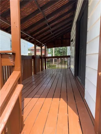 a view of balcony with wooden floor