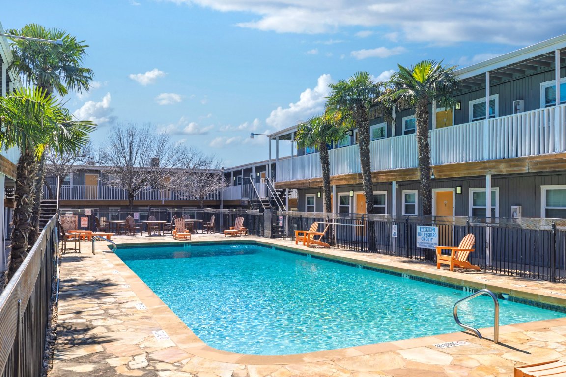 a view of a swimming pool with a patio