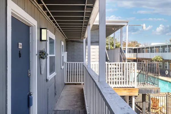 a view of a balcony with wooden floor