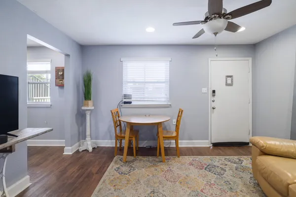 a workspace with furniture window and wooden floor