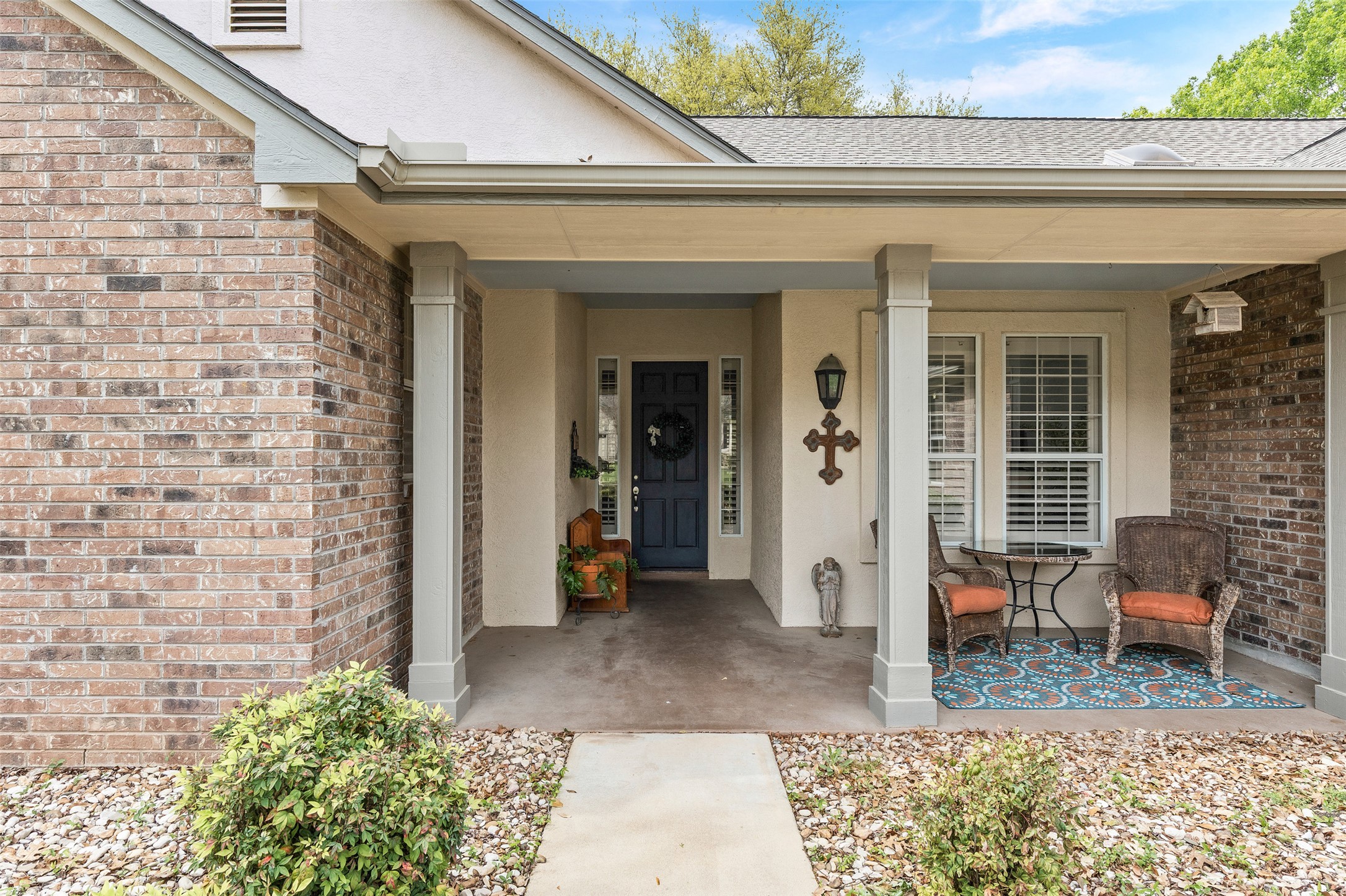 144 Stetson Trail Georgetown, TX 78633 - Photo 5 of 39 View of exterior entry featuring a covered porch and brick siding