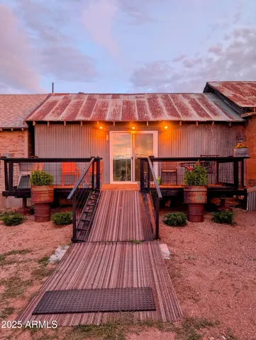 a view of room with window and wooden floor