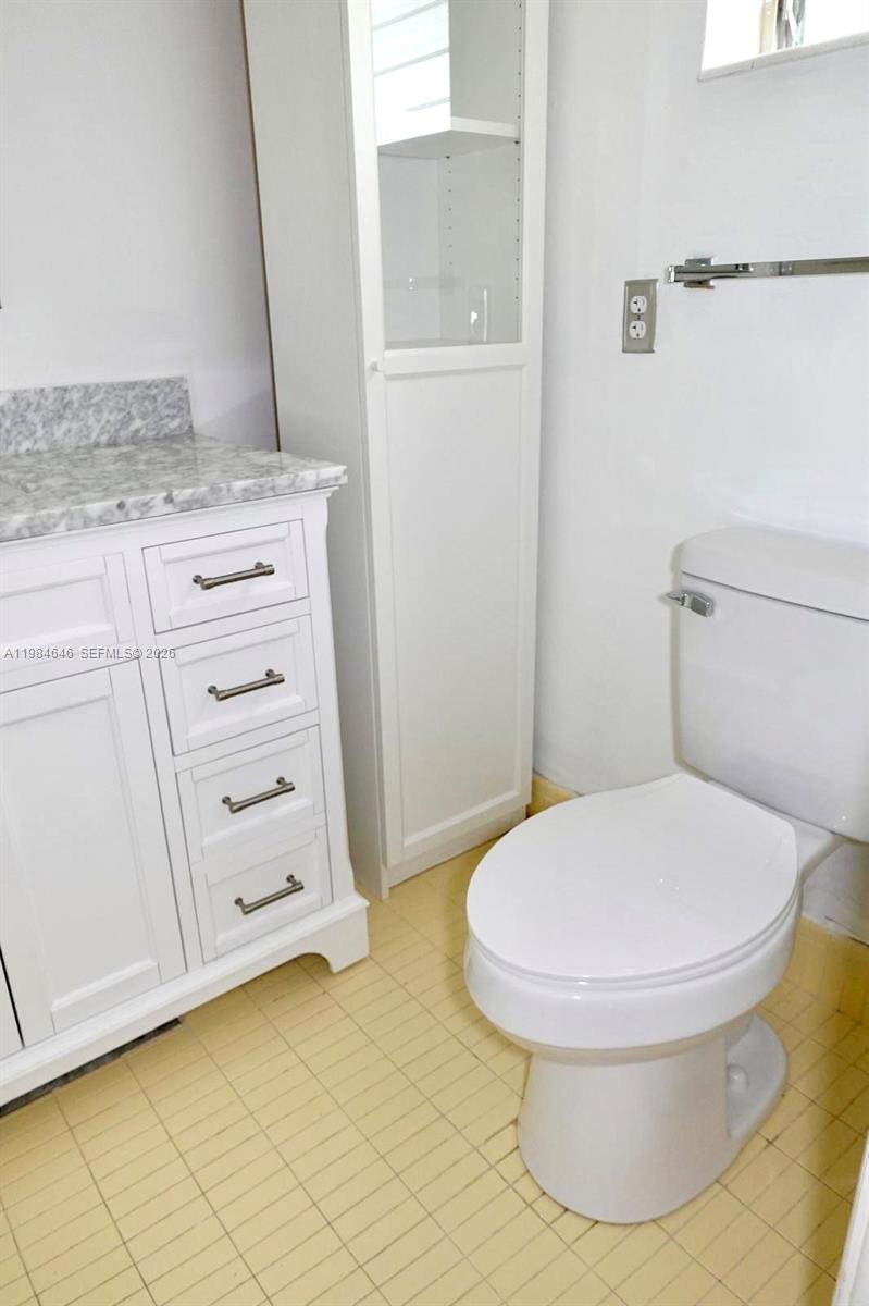 2501 South Ocean Boulevard, Unit 1040 Boca Raton, FL 33432 - Photo 16 of 16 a bathroom with a toilet and a sink