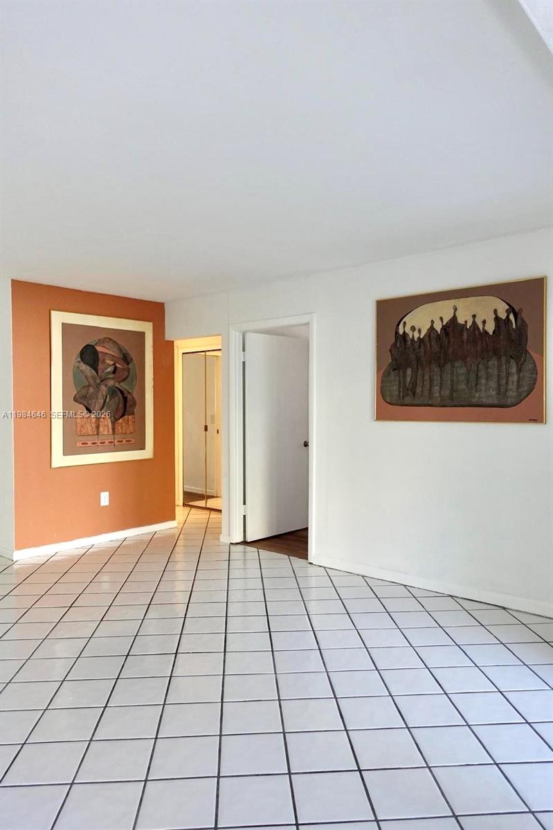2501 South Ocean Boulevard, Unit 1040 Boca Raton, FL 33432 - Photo 8 of 16 a view of an empty room and window