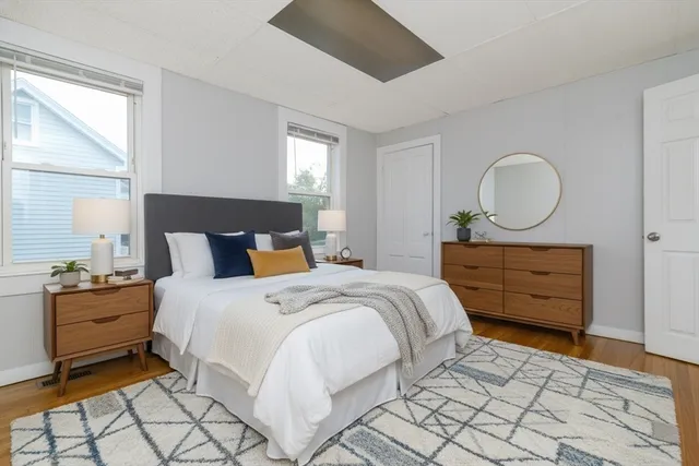 a bedroom with a bed and window