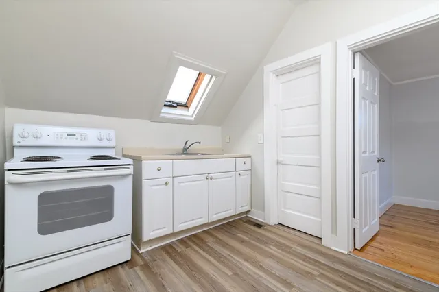 a view of a storage and utility room with washer and dryer