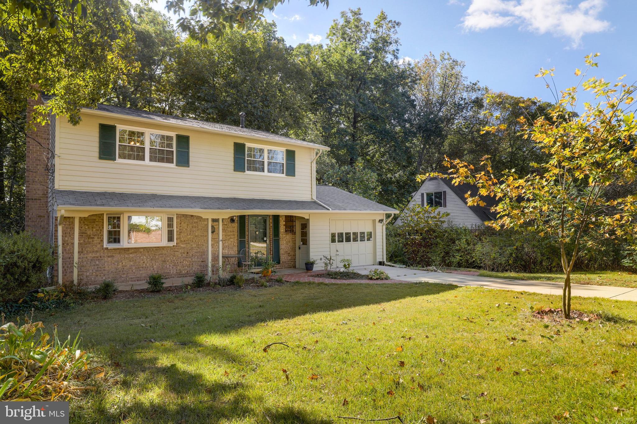 8461 Thames Street Springfield, VA 22151 - Photo 2 of 57 a front view of a house with a yard