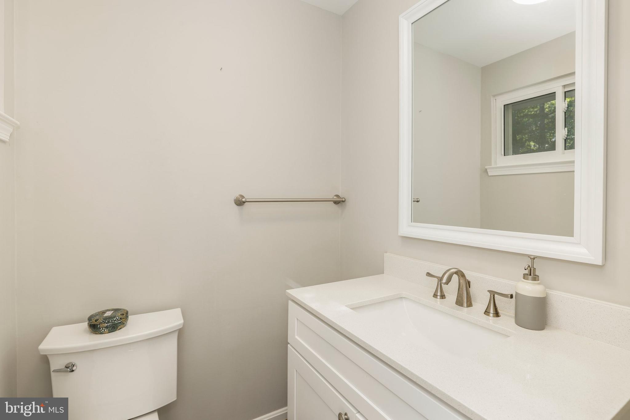 8461 Thames Street Springfield, VA 22151 - Photo 19 of 57 a bathroom with a sink and a toilet