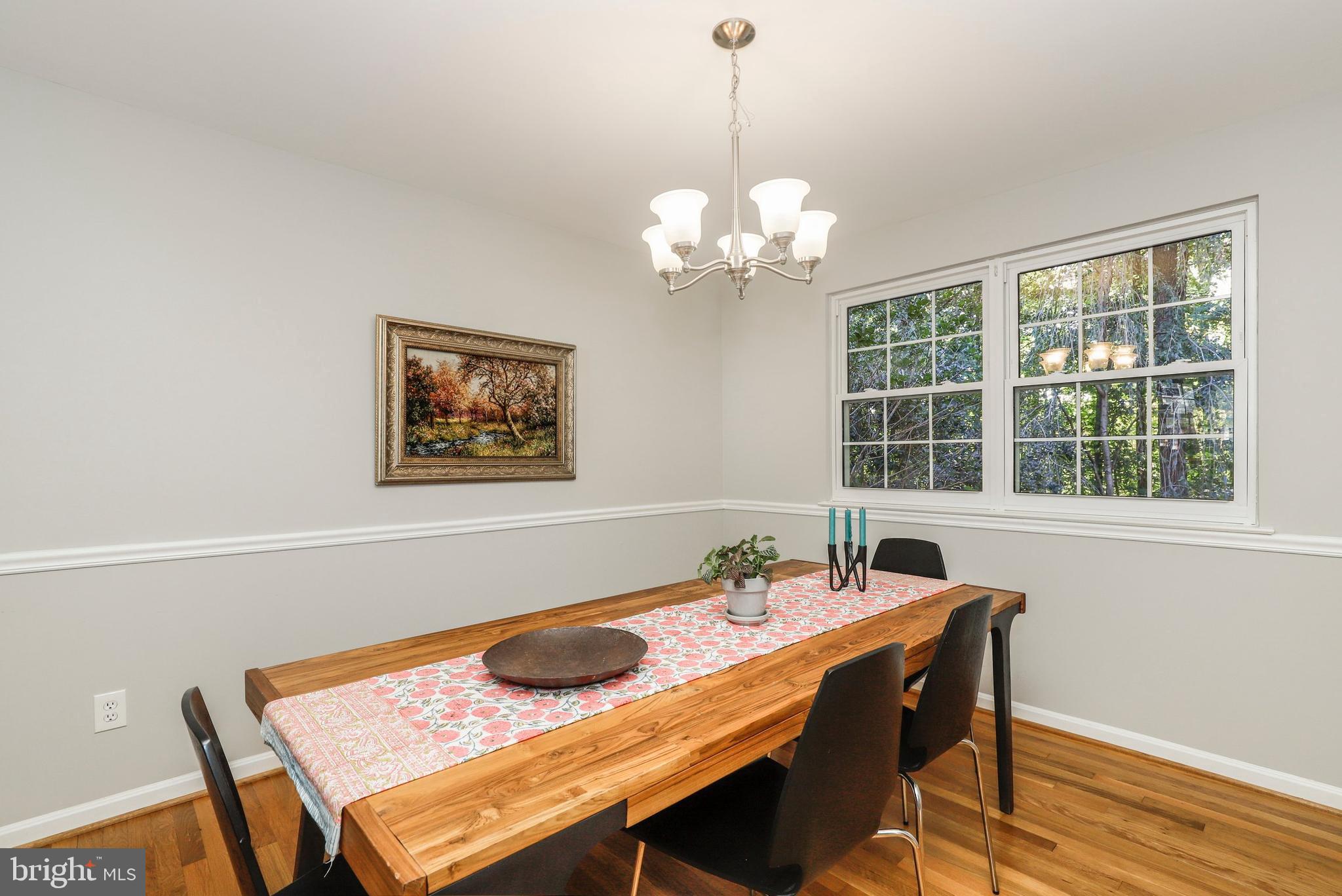 8461 Thames Street Springfield, VA 22151 - Photo 20 of 57 a view of a dining room with furniture window and wooden floor