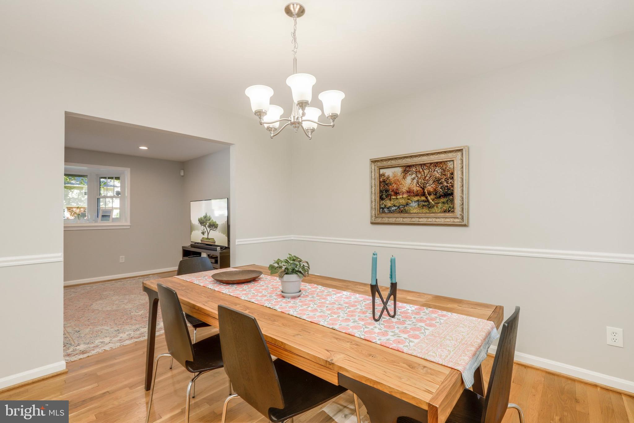 8461 Thames Street Springfield, VA 22151 - Photo 21 of 57 a view of a dining room with a table and chairs