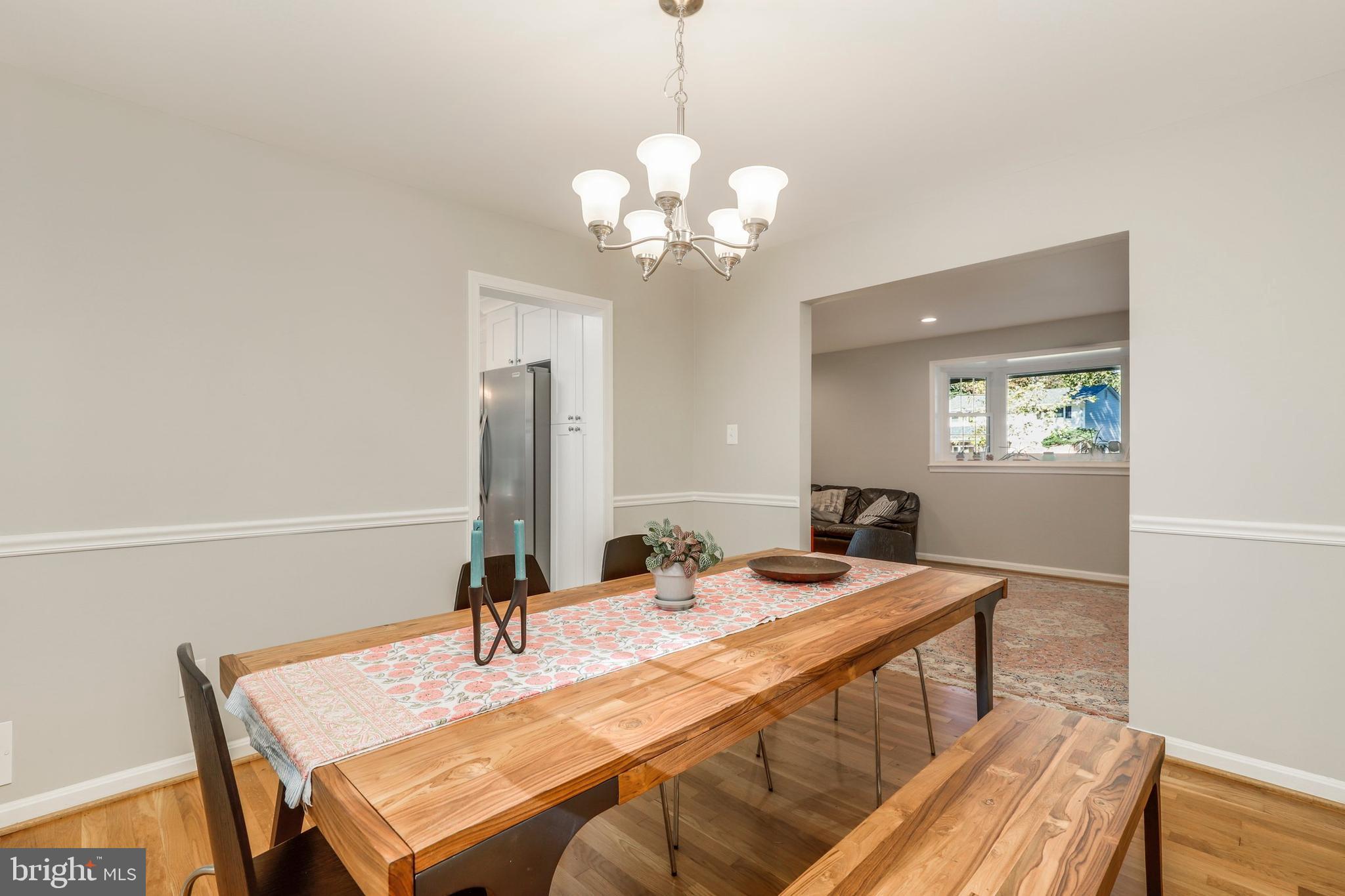 8461 Thames Street Springfield, VA 22151 - Photo 22 of 57 a view of a dining room with furniture and wooden floor