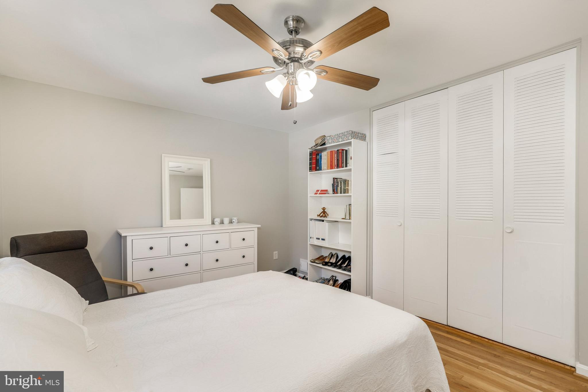 8461 Thames Street Springfield, VA 22151 - Photo 35 of 57 a bedroom with a bed and a chandelier