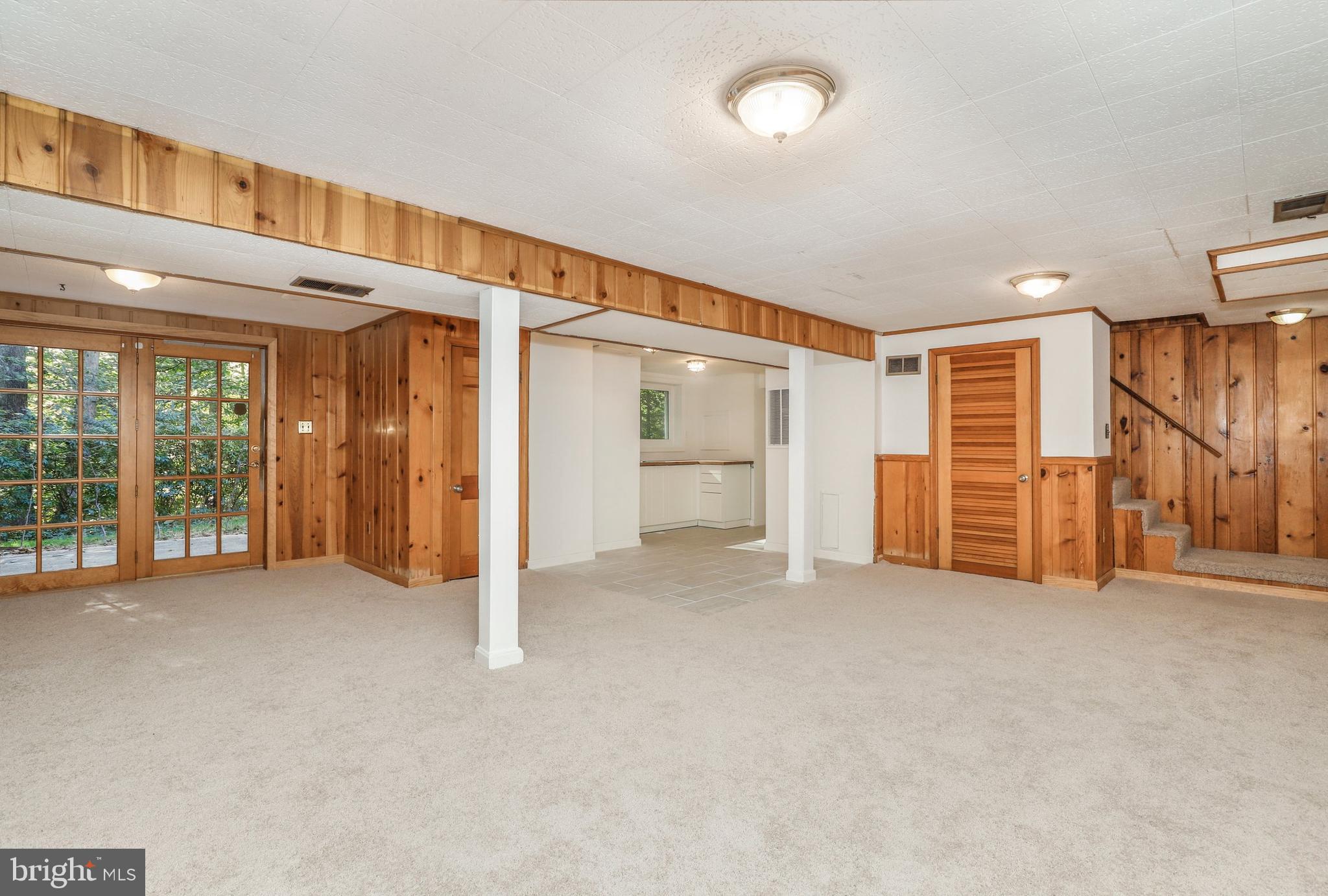 8461 Thames Street Springfield, VA 22151 - Photo 44 of 57 a view of an empty room with wooden floor and entryway