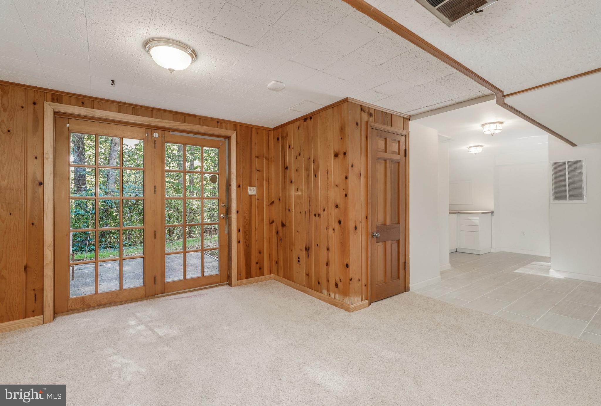8461 Thames Street Springfield, VA 22151 - Photo 45 of 57 an empty room with windows and bathroom view
