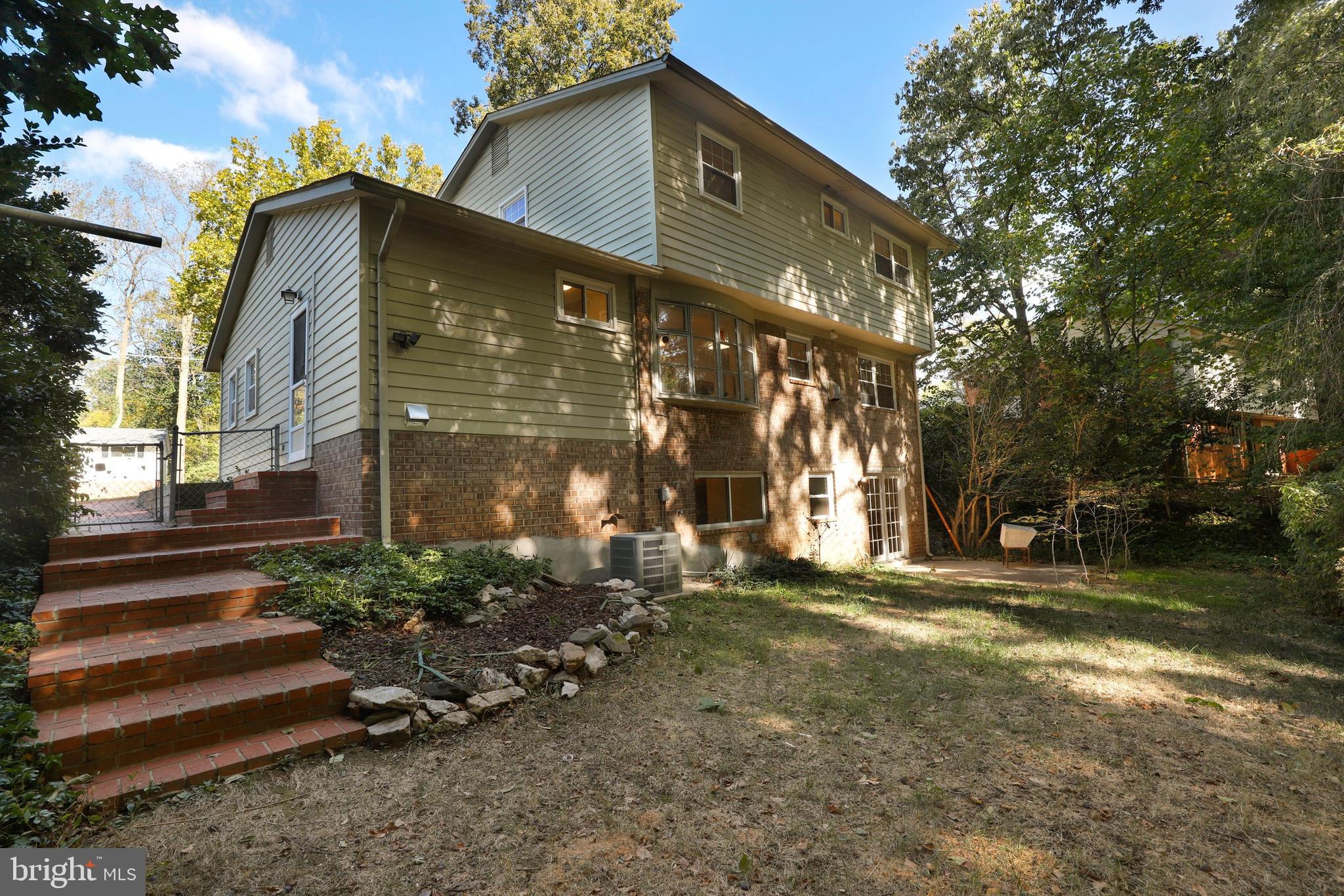 8461 Thames Street Springfield, VA 22151 - Photo 54 of 57 a view of a house with a yard