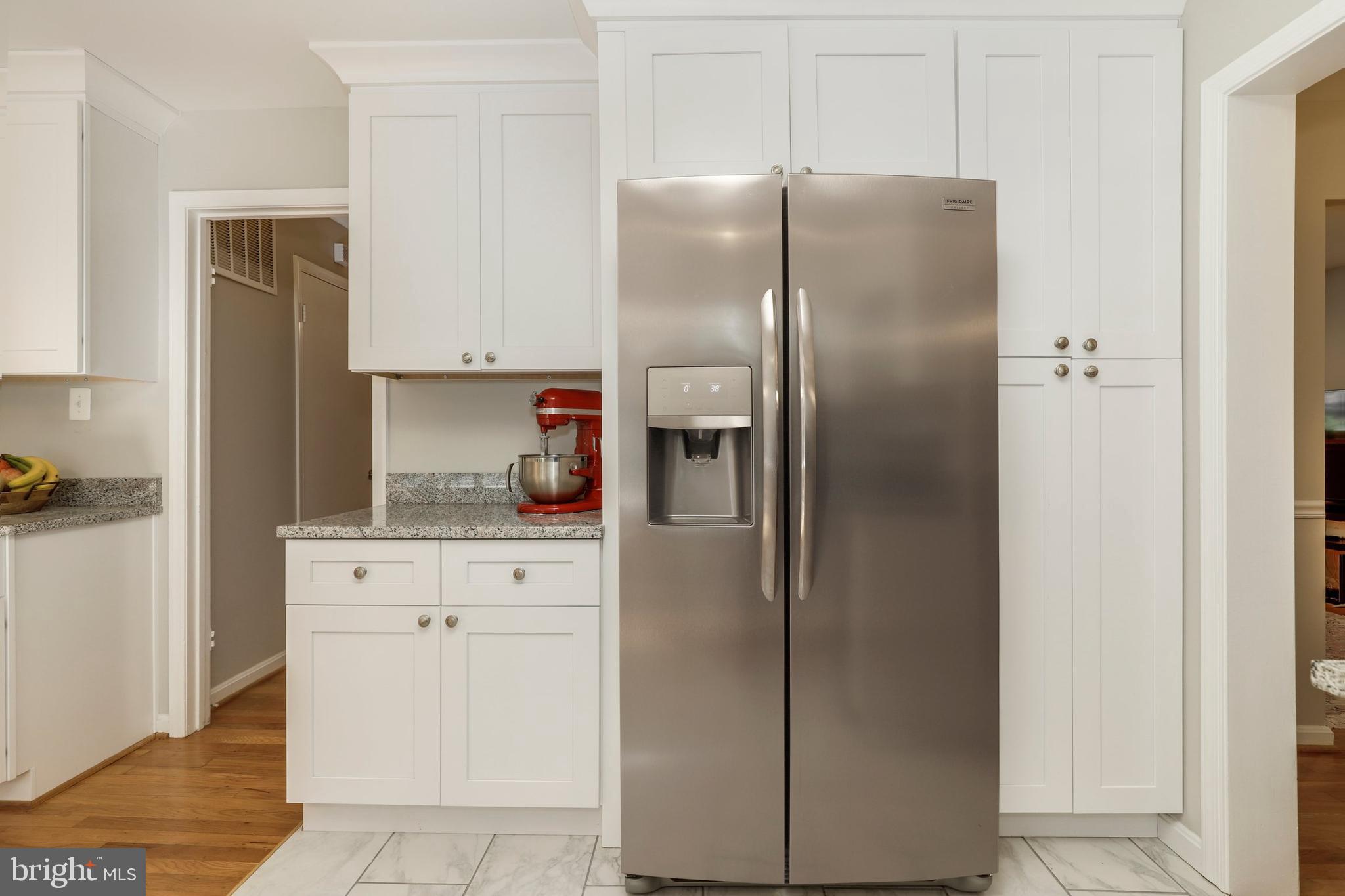 8461 Thames Street Springfield, VA 22151 - Photo 10 of 57 a kitchen with stainless steel appliances a refrigerator and cabinets