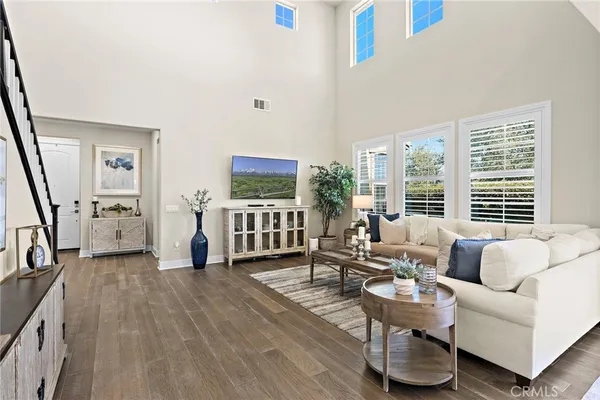 a living room with furniture or potted plant and a large window