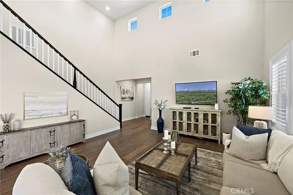 a bedroom with a large bed and a large window