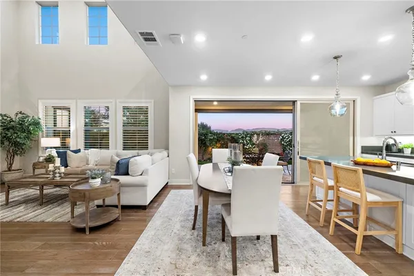 a view of a dining room with furniture window and wooden floor