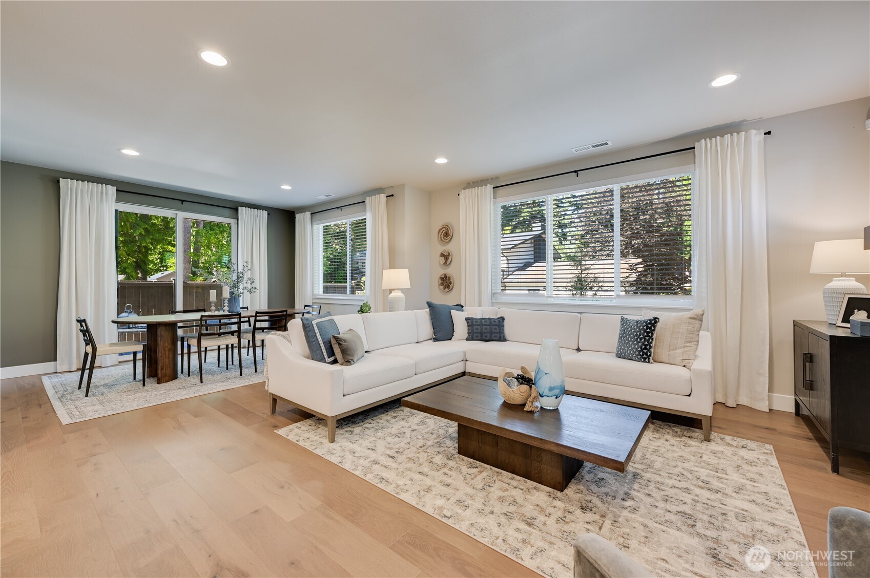19224 Meridian Drive Southeast, Unit CW 09 Bothell, WA 98012 - Photo 13 of 37 a living room with furniture and a large window