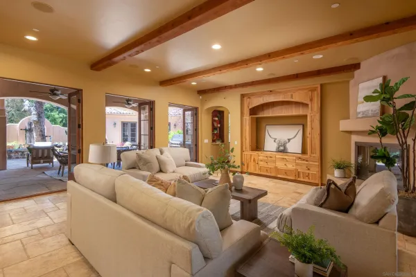 a living room with furniture and a large window