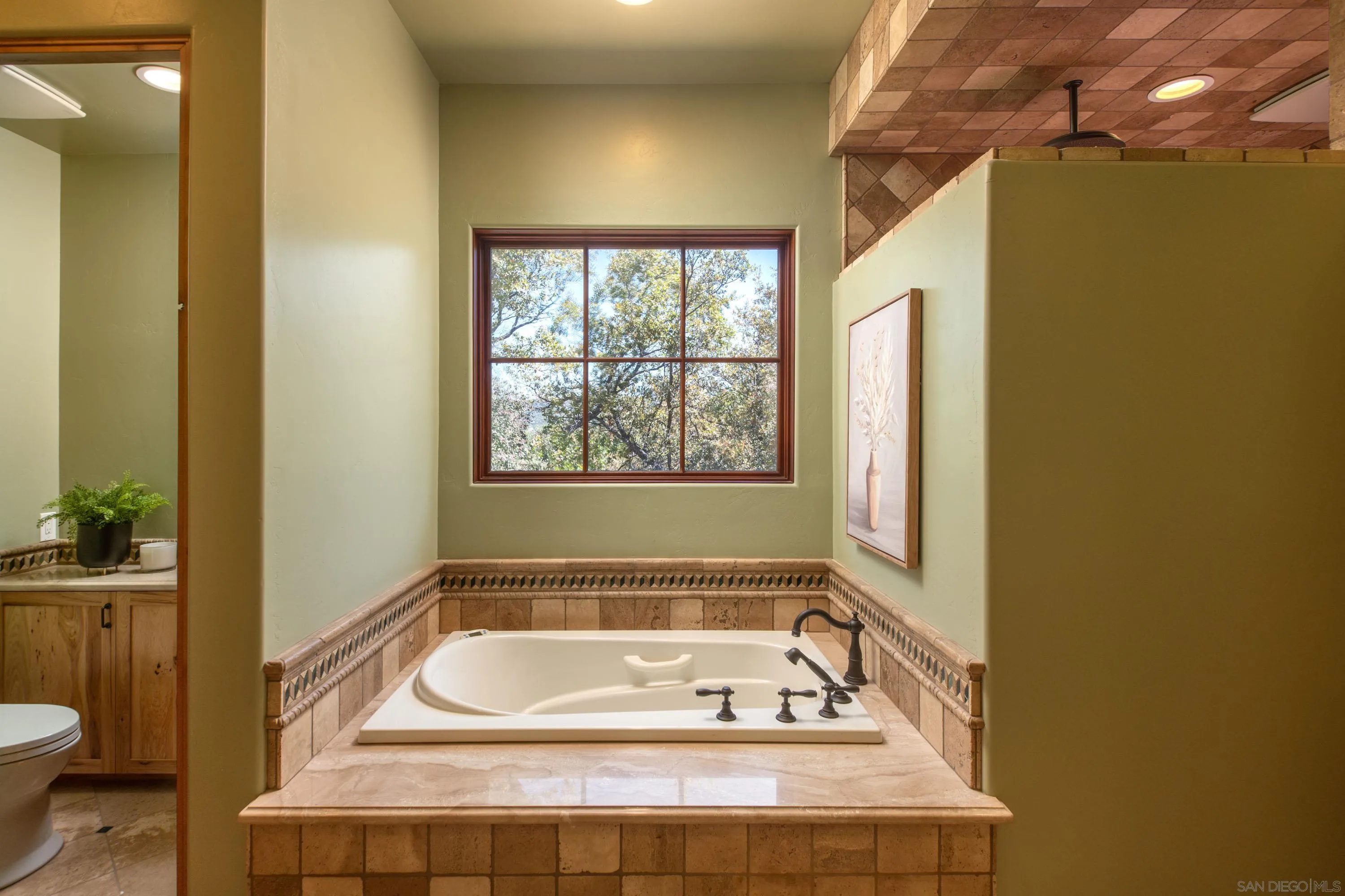 23835 Viejas Grade Road Descanso, CA 91916 - Photo 28 of 50 a bathroom with a bathtub and window