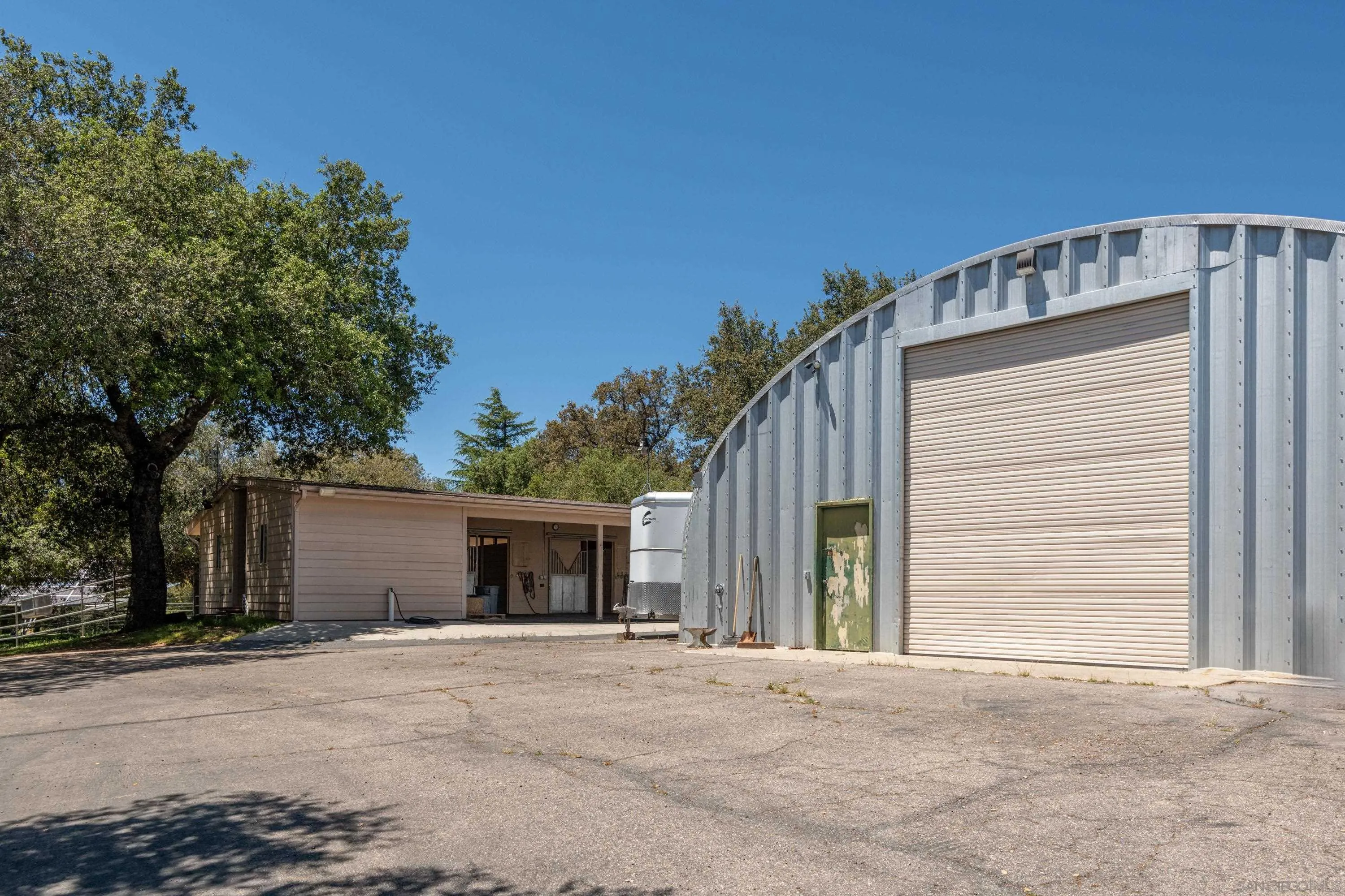 23835 Viejas Grade Road Descanso, CA 91916 - Photo 9 of 50 a front view of a house with a yard and garage