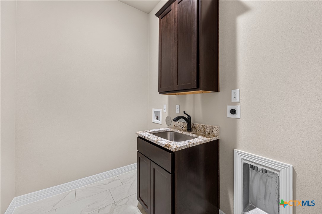2136 Oak Draw Court Belton, TX 76513 - Photo 36 of 46 a bathroom with a sink and a mirror