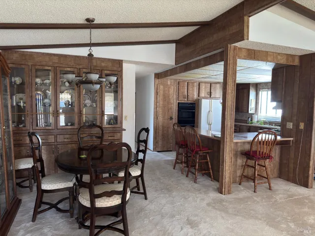 a view of a dining room with furniture window and chandelier