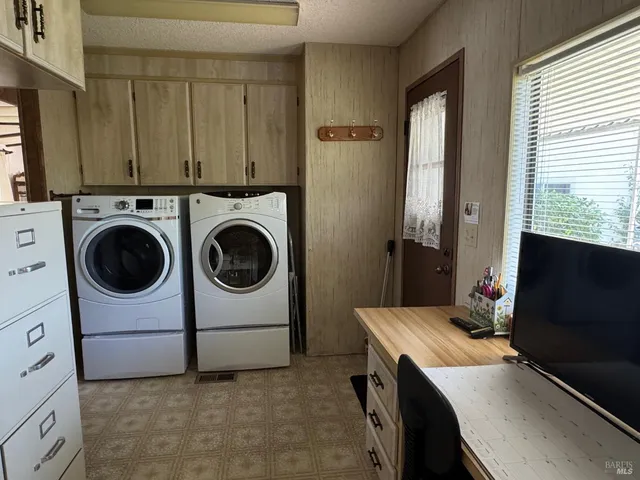 a utility room with dryer and washer