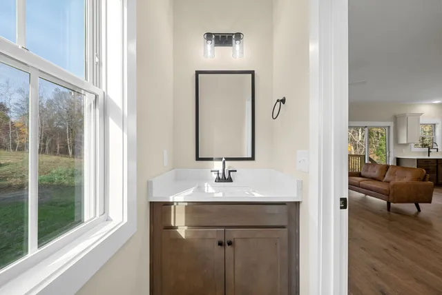 a bathroom with a sink and a mirror