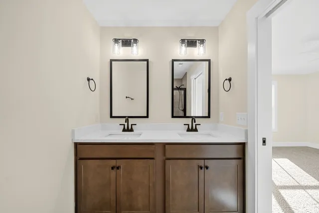 a bathroom with a glass shower door
