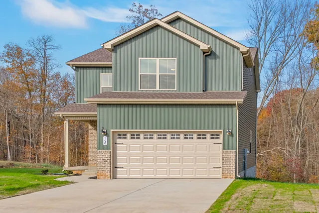 a front view of a house with a yard