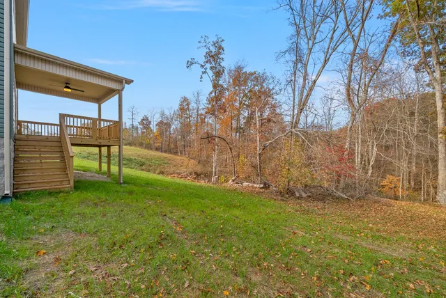 a front view of a house with a yard and pathway