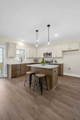 a bathroom with a sink vanity and a mirror