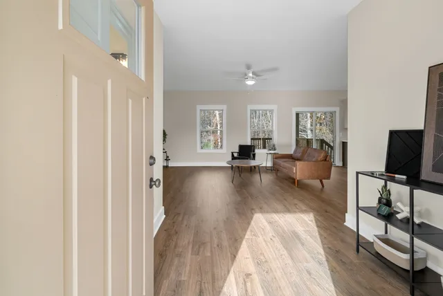 a view of a livingroom with furniture and a flat screen tv