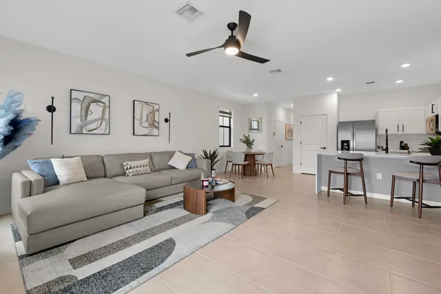 a dining room with furniture and window