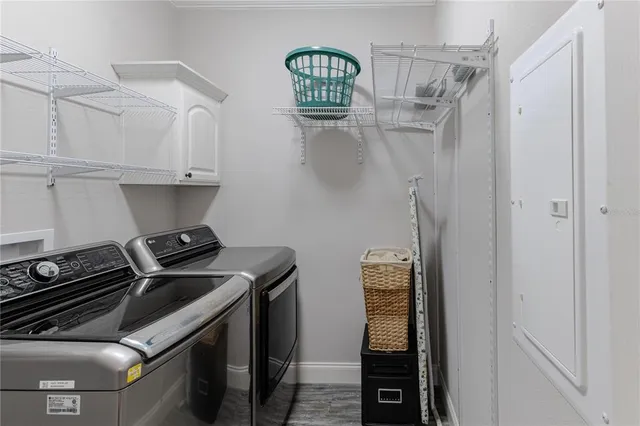 a view of roof deck with wooden floor and city view