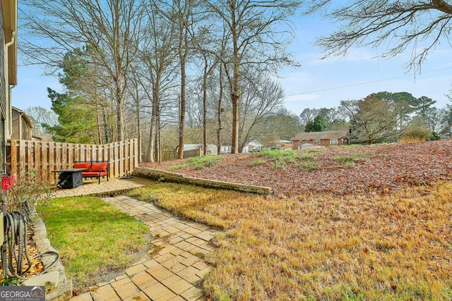 a backyard of a house with lots of green space