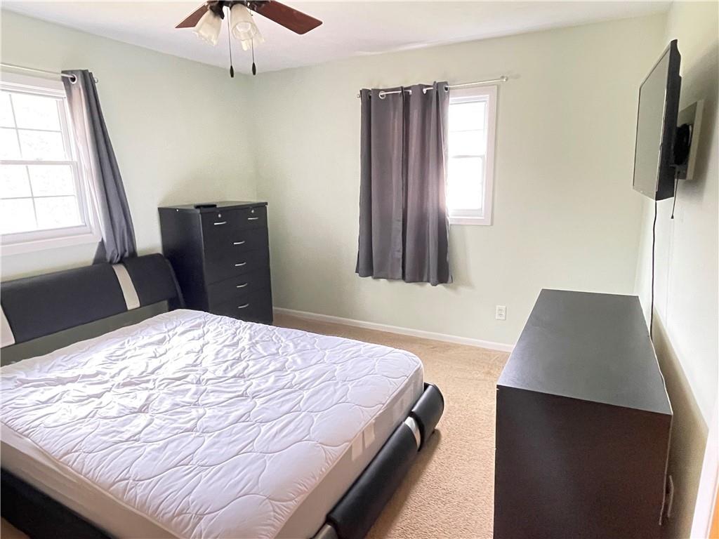 3034 Warren Road Indiana, PA 15701 - Photo 16 of 25 a bedroom with a bed and a flat tv screen on dresser