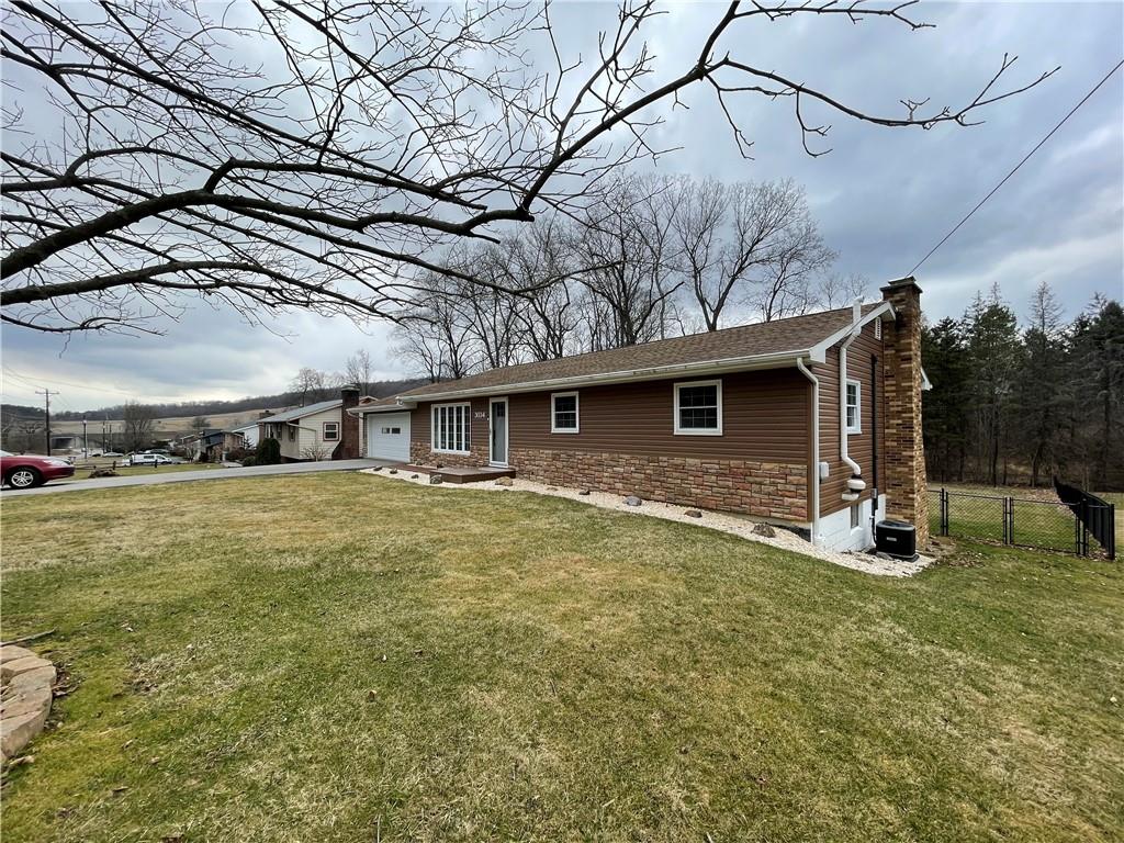 3034 Warren Road Indiana, PA 15701 - Photo 2 of 25 a front view of a house with a yard
