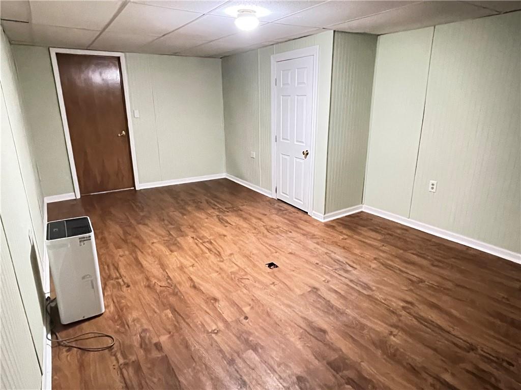 3034 Warren Road Indiana, PA 15701 - Photo 23 of 25 an empty room with wooden floor and mirror
