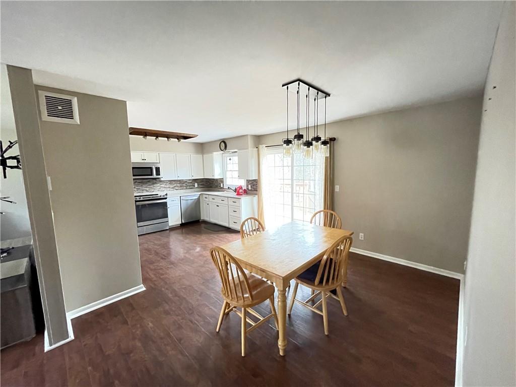3034 Warren Road Indiana, PA 15701 - Photo 5 of 25 a view of a dining room with furniture and wooden floor