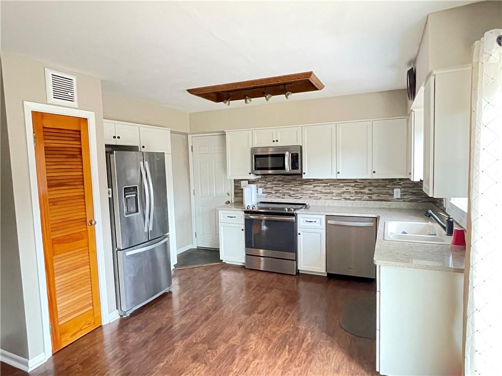 3034 Warren Road Indiana, PA 15701 - Photo 6 of 25 a kitchen with a refrigerator sink and microwave