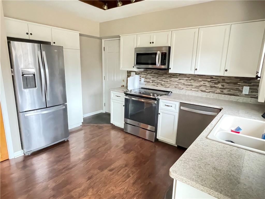 3034 Warren Road Indiana, PA 15701 - Photo 7 of 25 a kitchen with a refrigerator stove and microwave