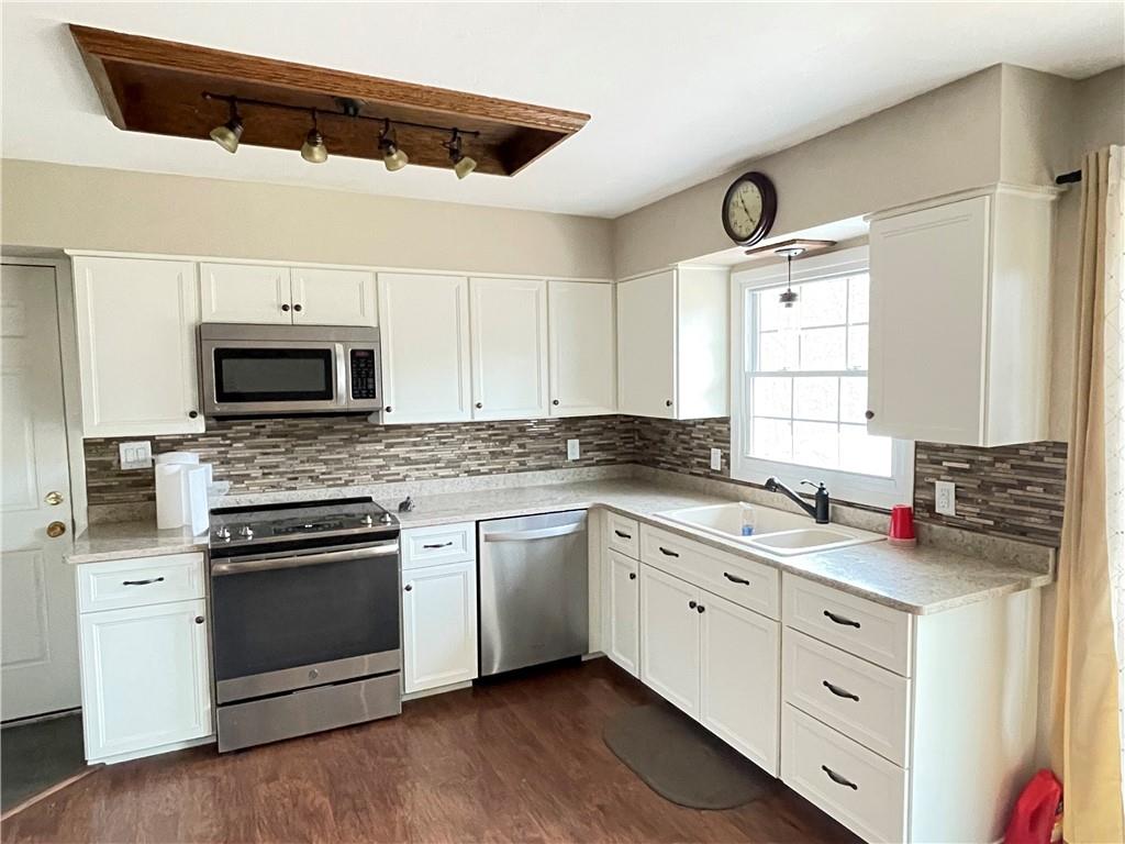 3034 Warren Road Indiana, PA 15701 - Photo 8 of 25 a kitchen with white cabinets and appliances